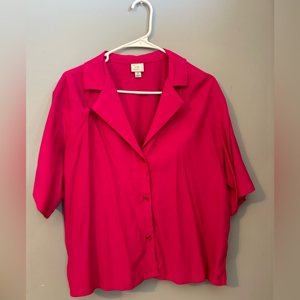Size medium, lightly worn, “a new day” hot pink woman’s top.